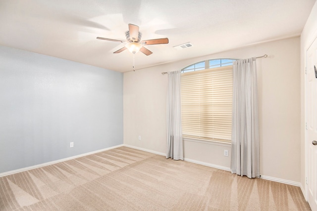 carpeted empty room with ceiling fan