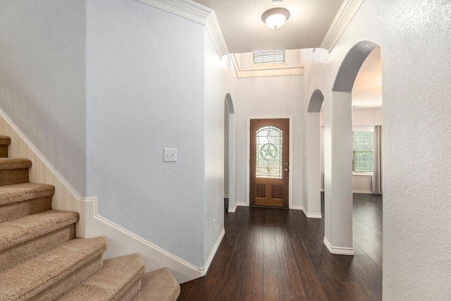 foyer with crown molding and dark hardwood / wood-style floors