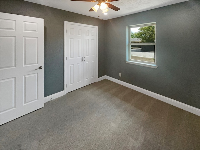 unfurnished bedroom featuring carpet flooring and ceiling fan