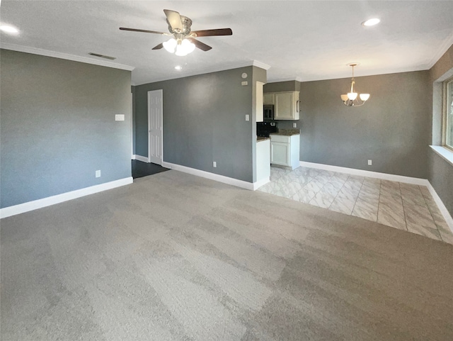 unfurnished living room featuring light carpet, ceiling fan with notable chandelier, and crown molding