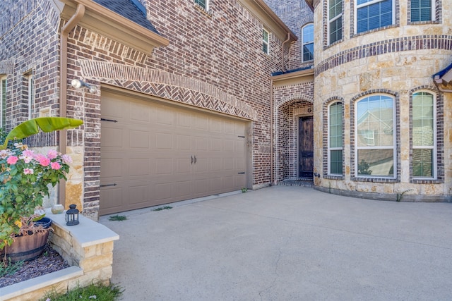 view of exterior entry featuring a garage