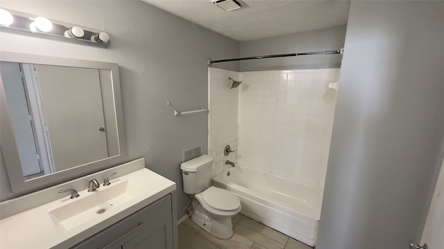 full bathroom with a textured ceiling, bathing tub / shower combination, vanity, and toilet