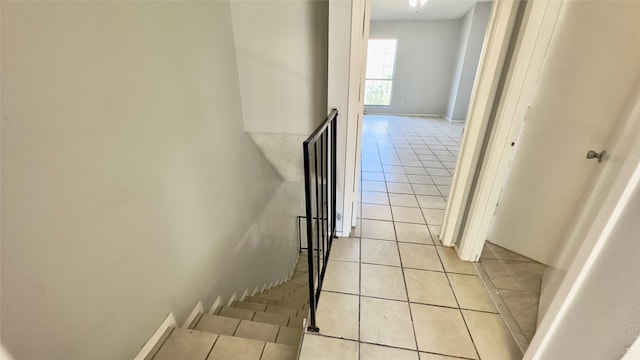 stairway featuring tile patterned floors