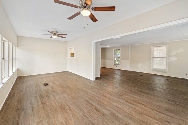 unfurnished room featuring hardwood / wood-style floors and ceiling fan