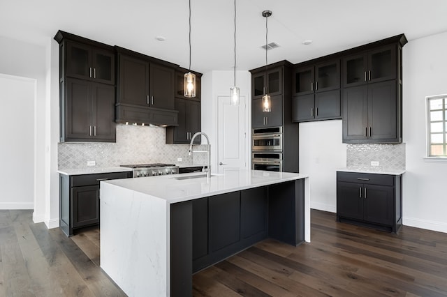 13638 Colony Mews, Frisco, TX 75033 - kitchen with tasteful backsplash, dark wood-style flooring, a sink, premium range hood, and stainless steel appliances
