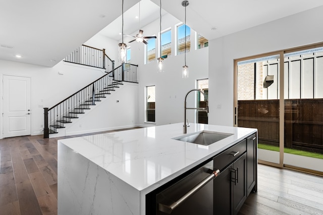 13638 Colony Mews, Frisco, TX 75033 - kitchen with a sink, a ceiling fan, hardwood / wood-style floors, and dishwashing machine
