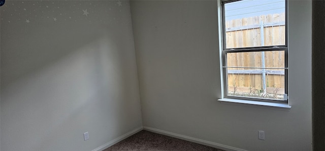 unfurnished room with carpet flooring