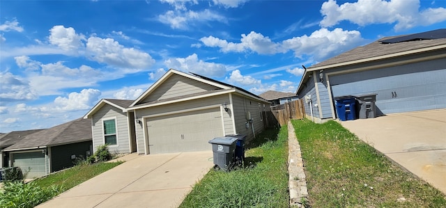 view of side of home with a garage