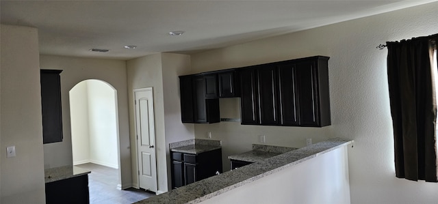 kitchen featuring light stone counters