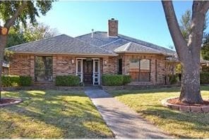 ranch-style house with a front yard