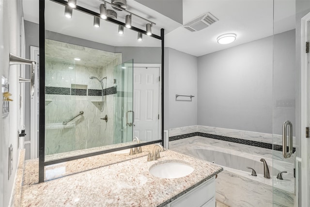 bathroom featuring vanity and plus walk in shower