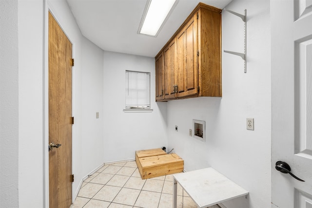 laundry room with washer hookup, cabinets, light tile patterned flooring, and electric dryer hookup