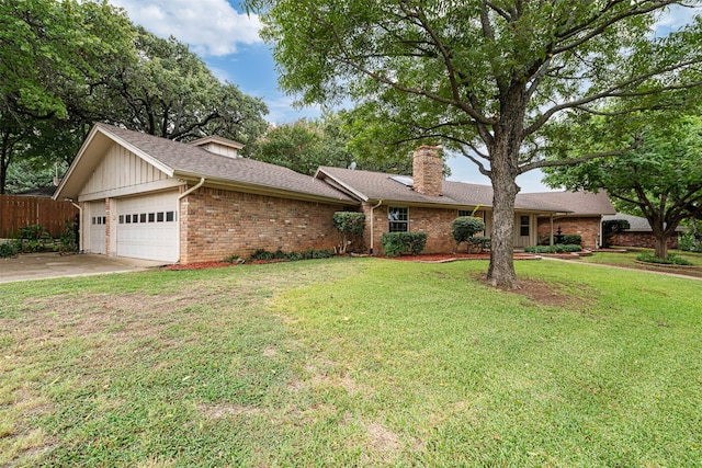 ranch-style house featuring a front yard and a garage