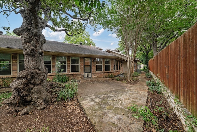 back of house with a patio