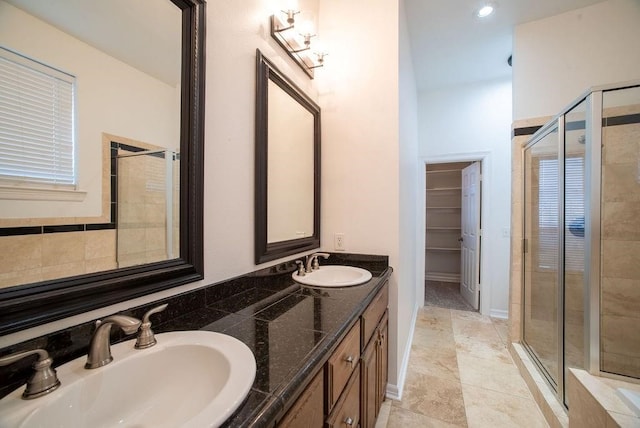 bathroom with vanity and an enclosed shower