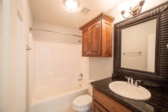 full bathroom featuring vanity, bathtub / shower combination, and toilet