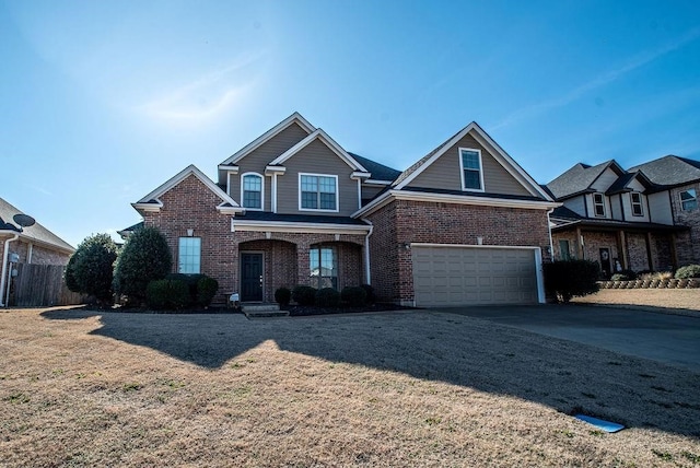 view of front facade featuring a front yard, a porch, and a garage