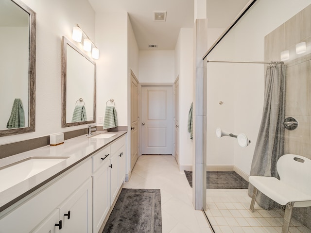 bathroom with tile patterned flooring, vanity, and a shower with shower curtain