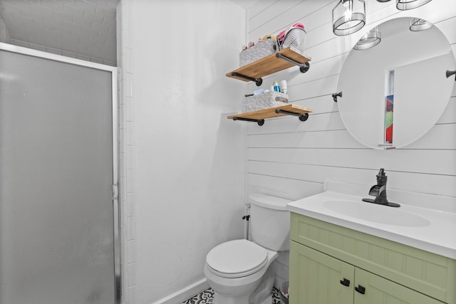 bathroom featuring vanity, wooden walls, toilet, and an enclosed shower