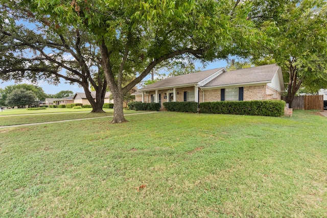 ranch-style house featuring a front lawn