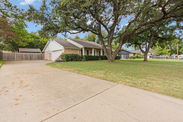 view of front of house with a garage and a front lawn