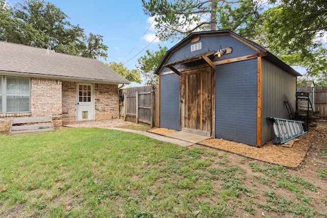 view of outbuilding with a lawn