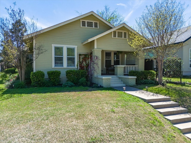 view of front facade with a porch and a front yard