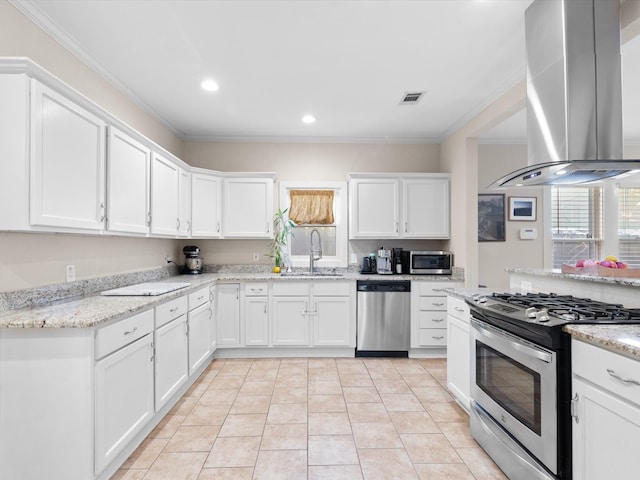 kitchen with sink, stainless steel appliances, island range hood, ornamental molding, and white cabinets