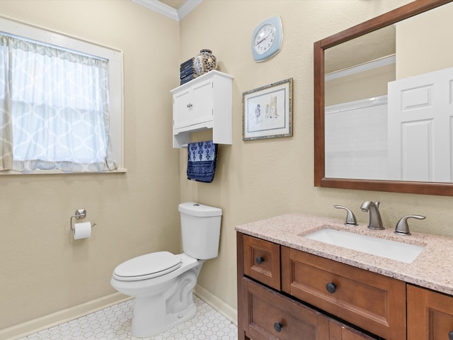 bathroom with crown molding, vanity, and toilet