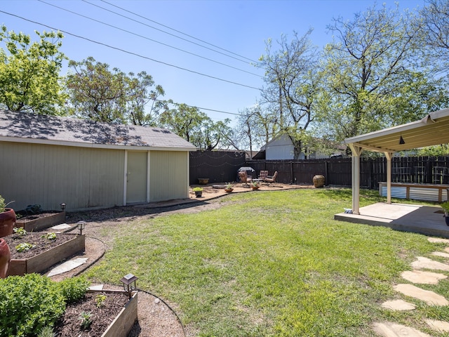 view of yard with a storage shed and a patio area