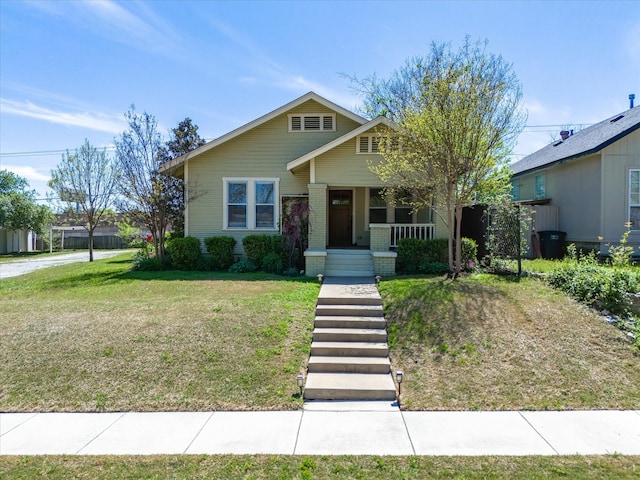 view of front facade with a front yard and a porch