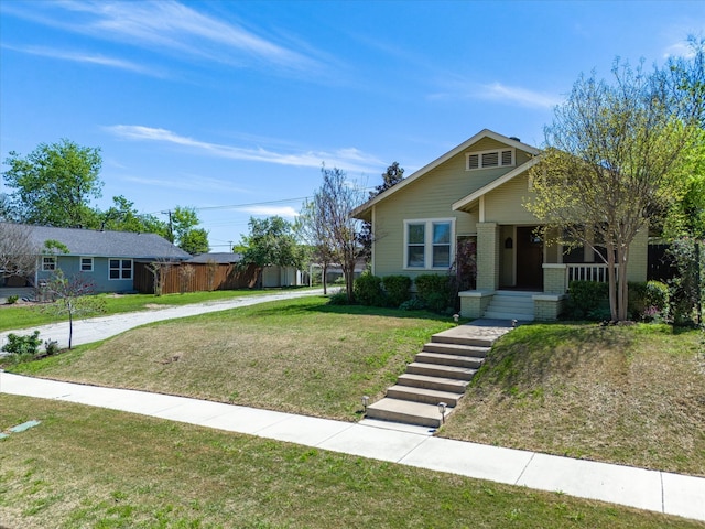 view of front facade with covered porch and a front yard