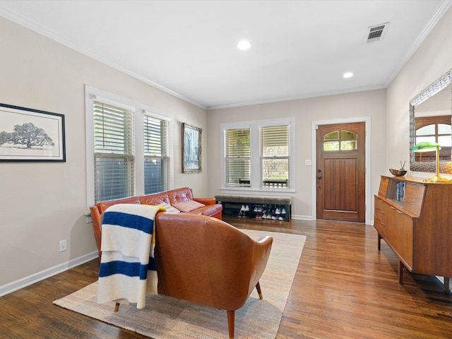 living room featuring wood-type flooring and ornamental molding