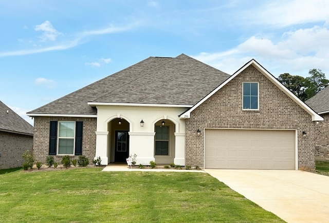290 Cessna Dr, Shreveport, LA 71106 - view of front facade with driveway, brick siding, a garage, roof with shingles, and a front lawn