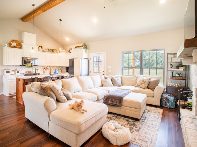 living room featuring beam ceiling, sink, dark wood-type flooring, and high vaulted ceiling