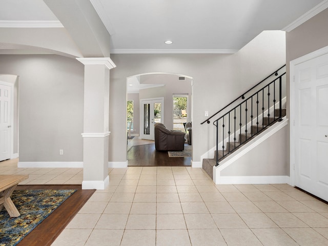 dining area with ornamental molding, tile patterned flooring, and a notable chandelier