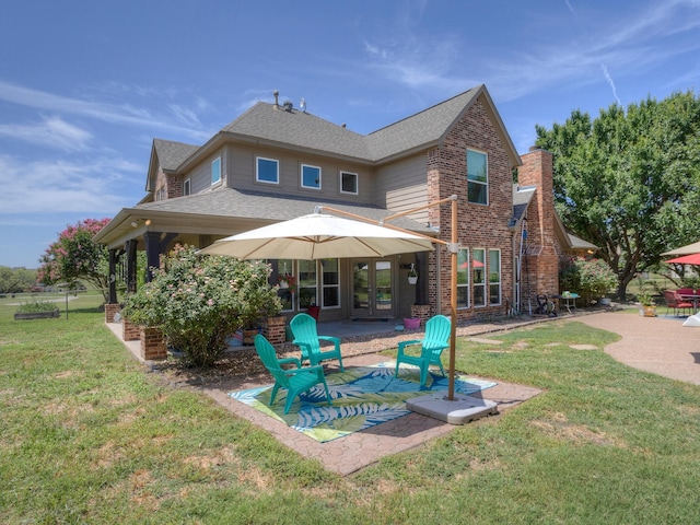 view of swimming pool with a yard and a patio area