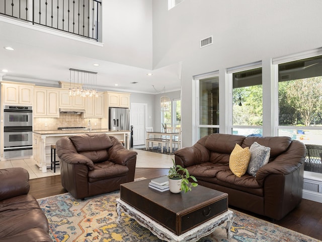 kitchen featuring hanging light fixtures, a kitchen island with sink, a kitchen breakfast bar, and stainless steel appliances