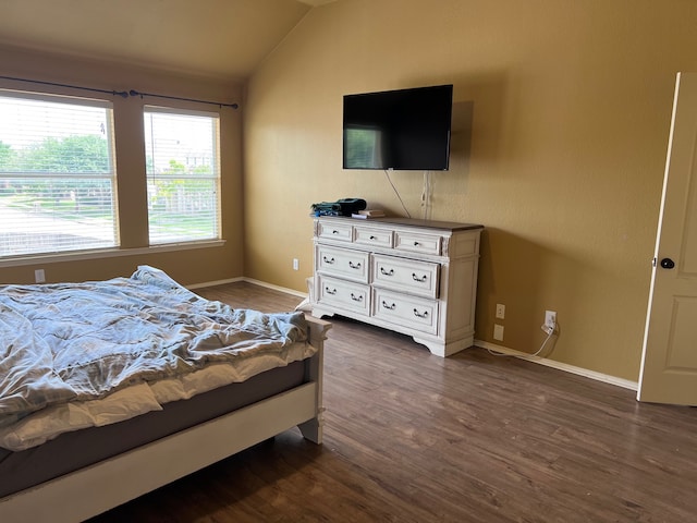 bedroom with dark wood-type flooring and vaulted ceiling