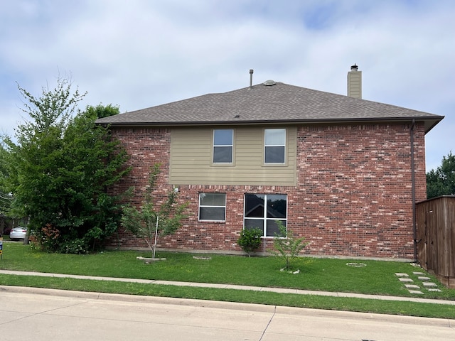 view of property exterior with a lawn