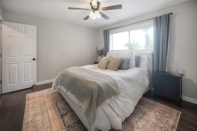 bedroom featuring dark hardwood / wood-style flooring and ceiling fan