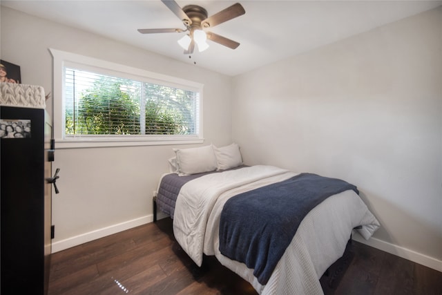 bedroom featuring dark hardwood / wood-style floors and ceiling fan