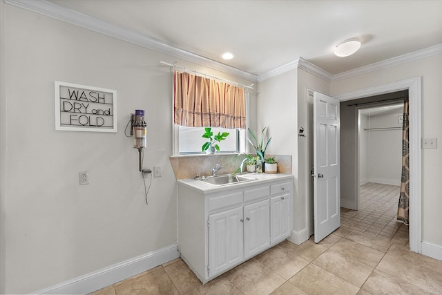 interior space featuring crown molding, sink, white cabinets, and light tile patterned floors