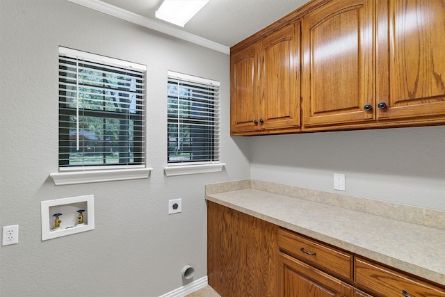 laundry room with cabinets, hookup for an electric dryer, washer hookup, and ornamental molding