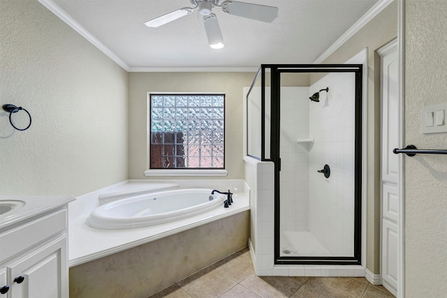 bathroom with independent shower and bath, vanity, ornamental molding, and a textured ceiling