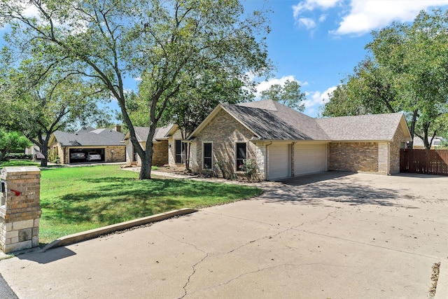 view of front facade featuring a front yard and a garage