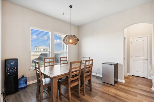 dining room featuring plenty of natural light and hardwood / wood-style floors