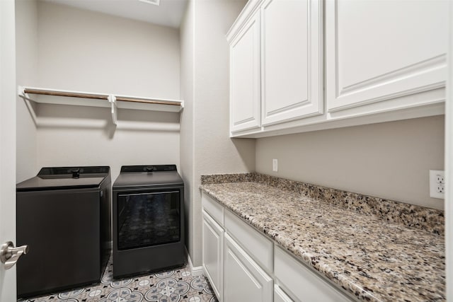 laundry room with cabinets and independent washer and dryer