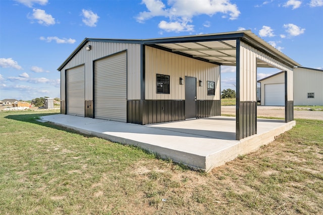 exterior space with a lawn and a garage