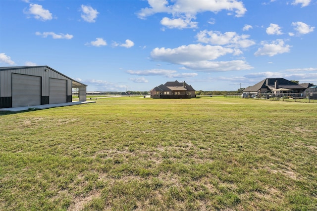 view of yard featuring an outbuilding and a garage